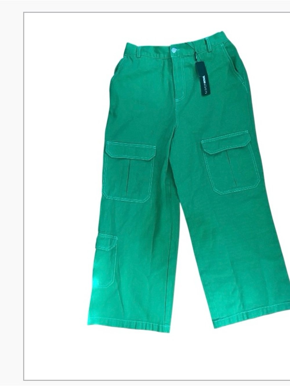 Fashion Nova green cargo jeans featuring prominent white contrast stitching.